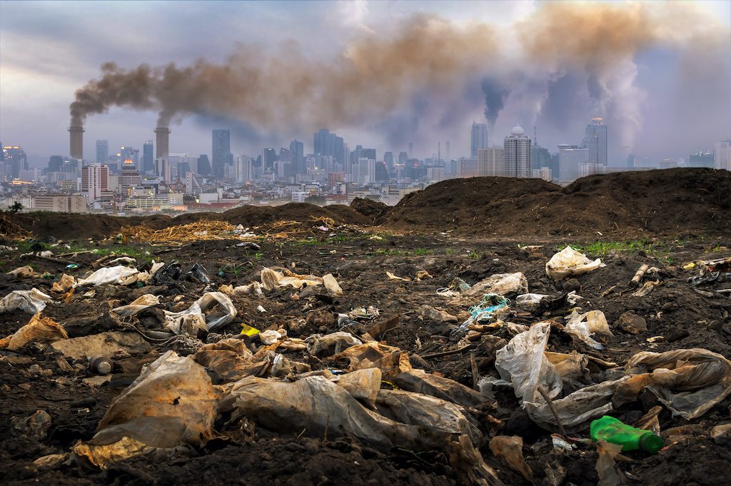 multiple streams of industrial and plastic pollution with city background